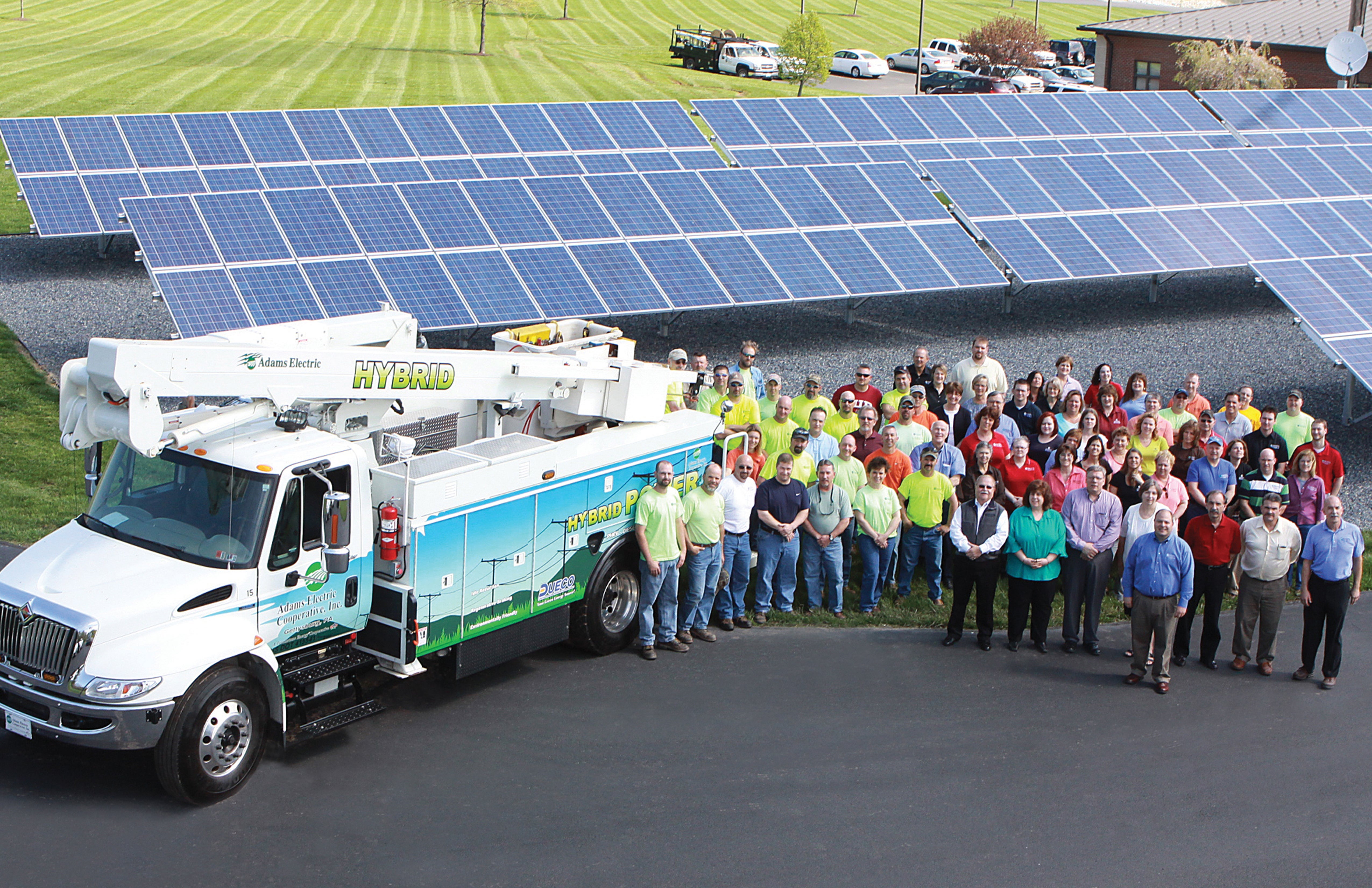 adams-employees-w-truck-solar