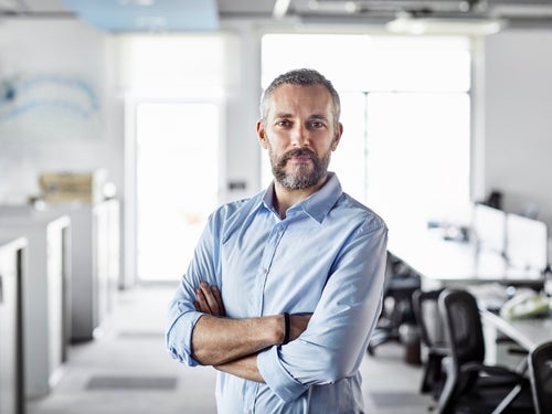 Businessman standing in empty office
